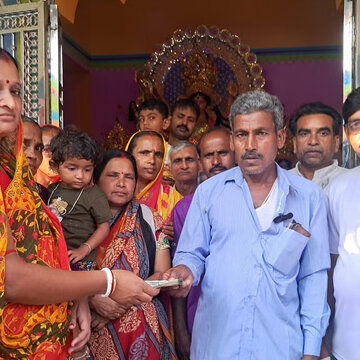Village 'Lakshmis' donate a month's 'Lokkhi’r Bhandar' funds for Durga temple construction