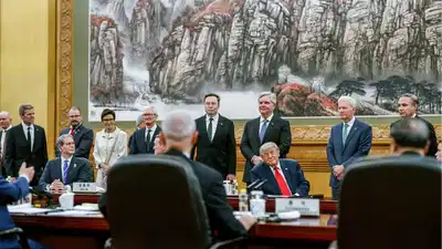 Elon Musk’s facial expressions during China banquet go viral, spark online frenzy