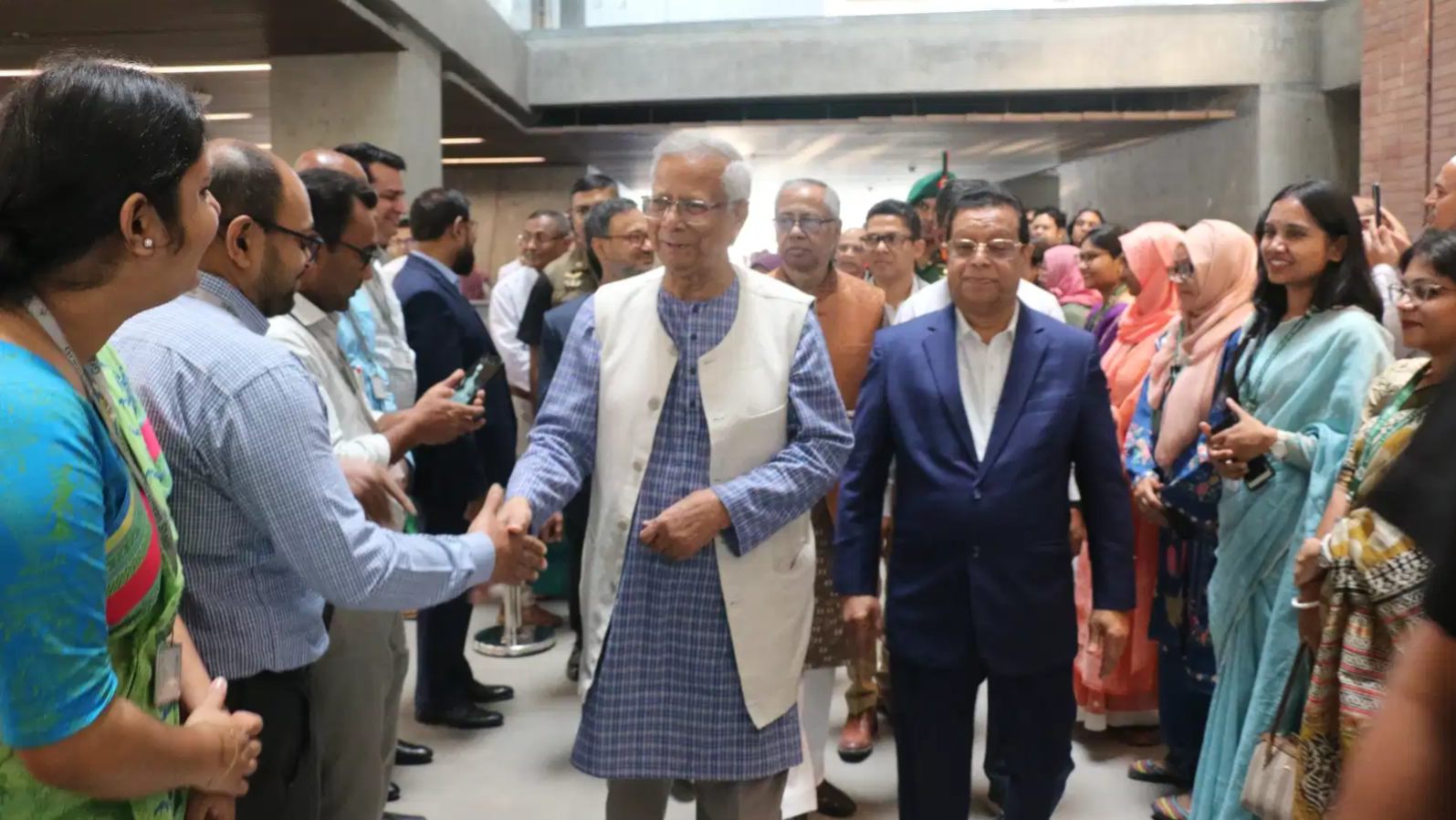 Muhammad Yunus returns to work after stepping down as interim chief of Bangladesh government