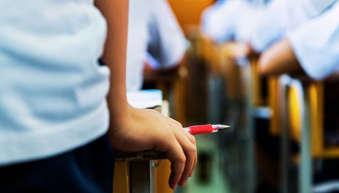 Father couldn't pay fees, son made to sit on classroom floor for exam