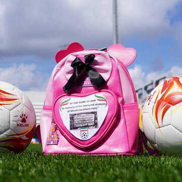 Iran footballers’ schoolbag tribute honours slain girls in powerful protest