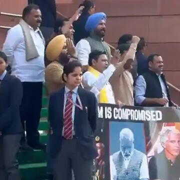 Lok Sabha adjourned till 12 pm amid Opposition protests, suspended MPs protest outside Parliament