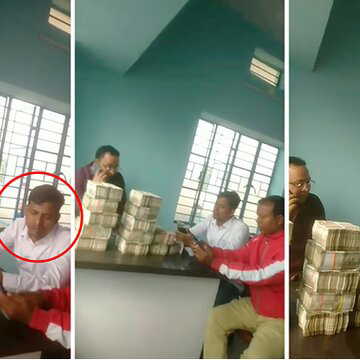 टेबल पर नोटों के बंडल का पहाड़ : सामने बैठे तृणमूल नेता ग्यासुद्दीन मंडल, सोशल मीडिया पर वीडियो वायरल